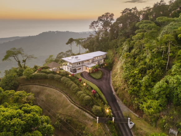 Discover the luxurious Estate Above Dominical, featuring 5 bedrooms, ocean views, and seamless indoor-outdoor living